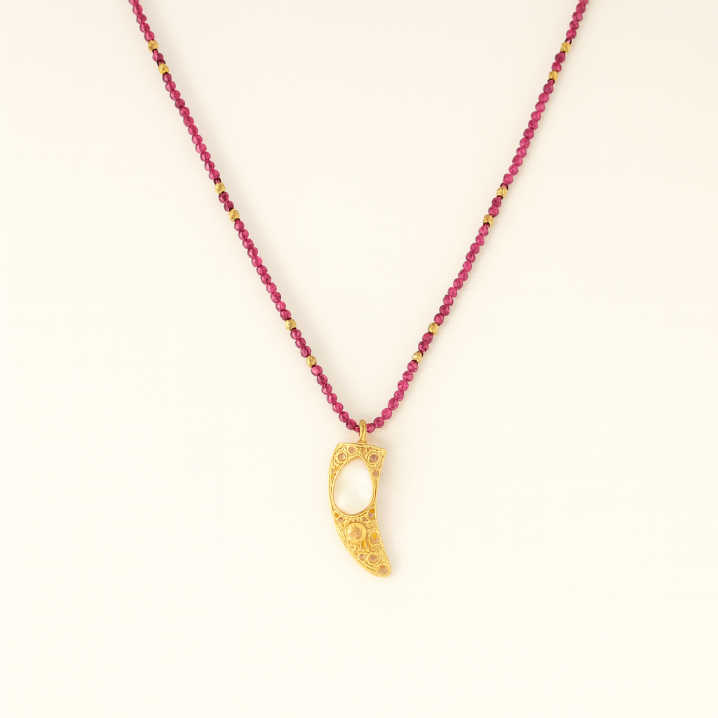 Necklace with pink beads and a gold pendant on a white background