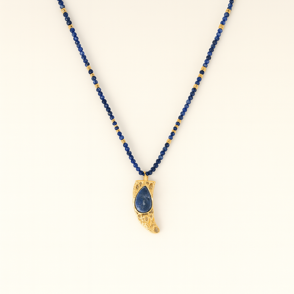 Necklace with blue beads and a gold pendant on a white background