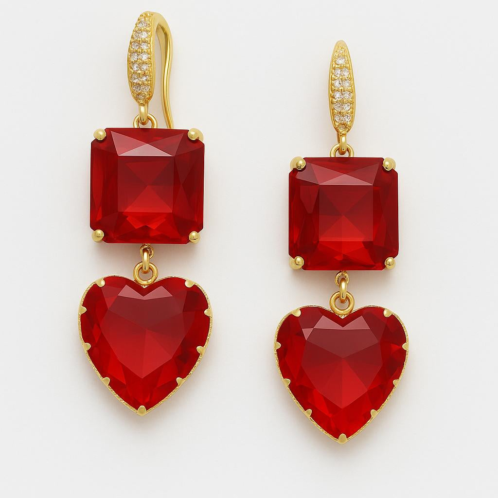 Red heart-shaped earrings with gold accents on a white background