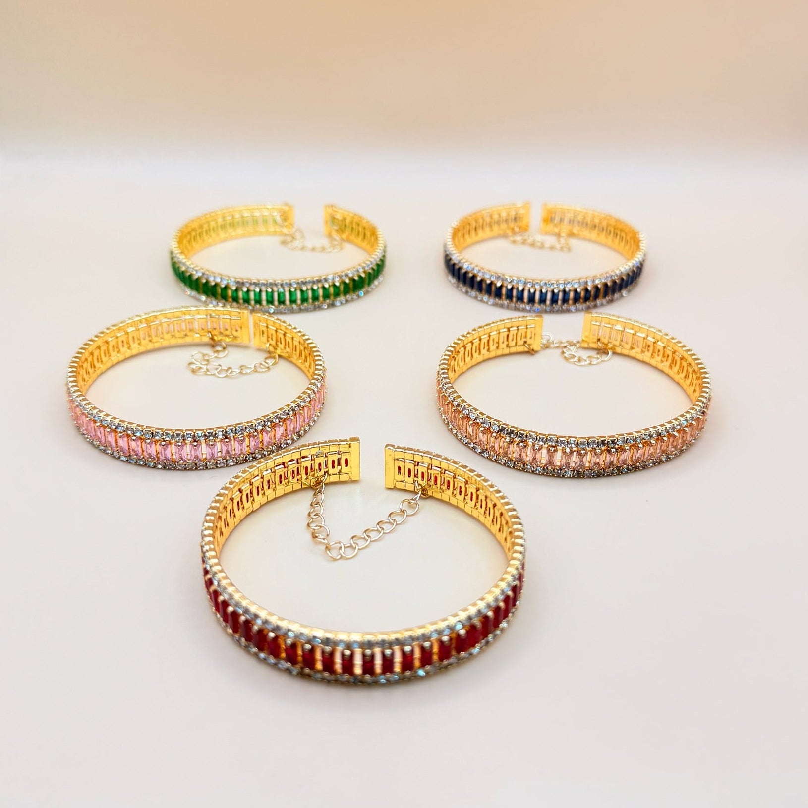 Set of colorful beaded bracelets on a light background