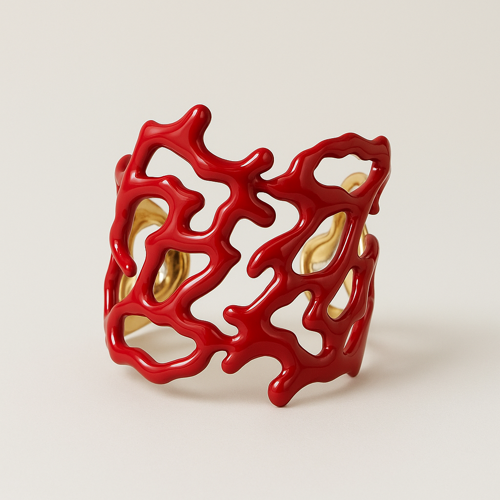 Red coral-like cuff bracelet on a light beige background